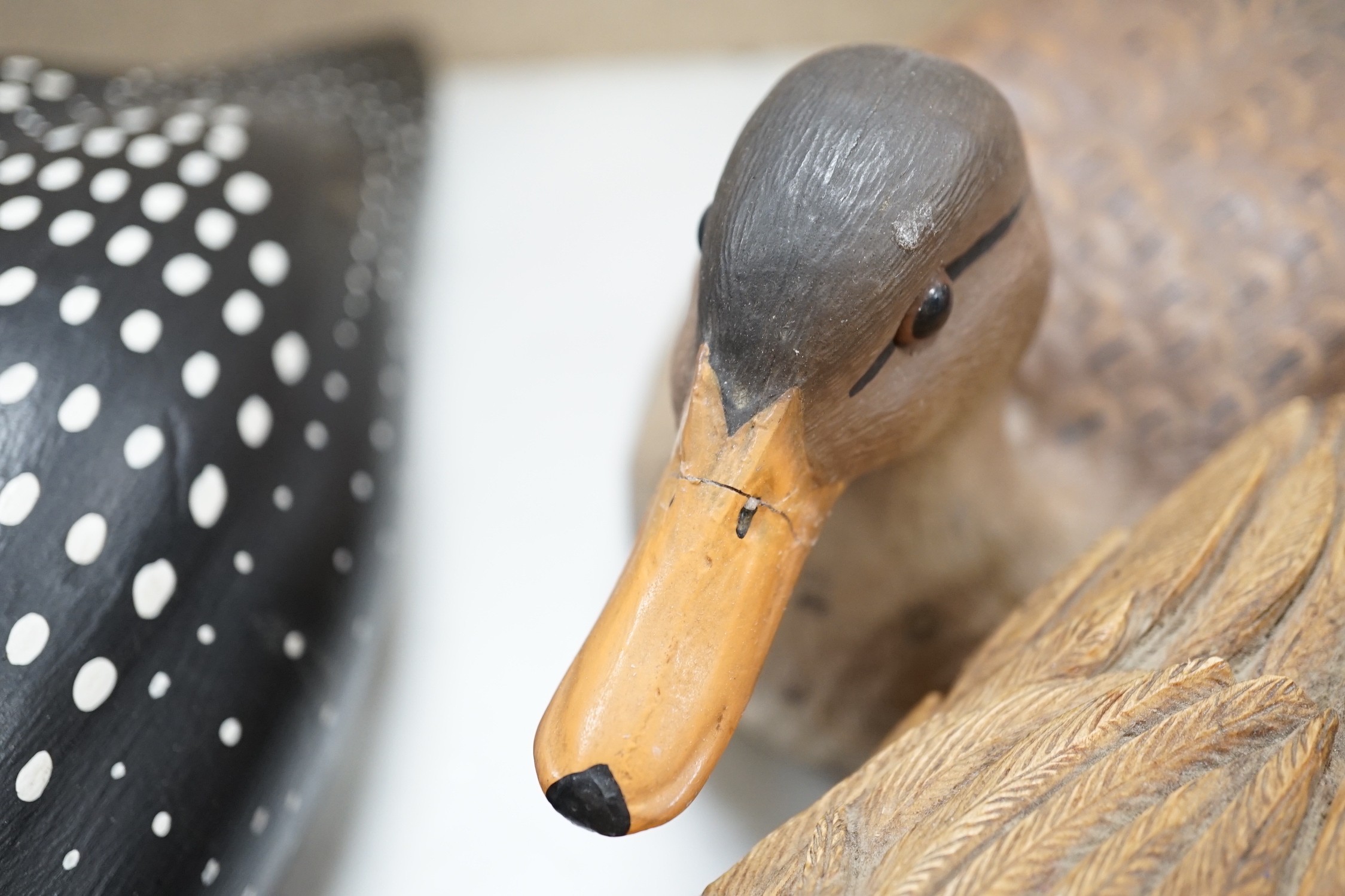 Nine carved wood decoy ducks